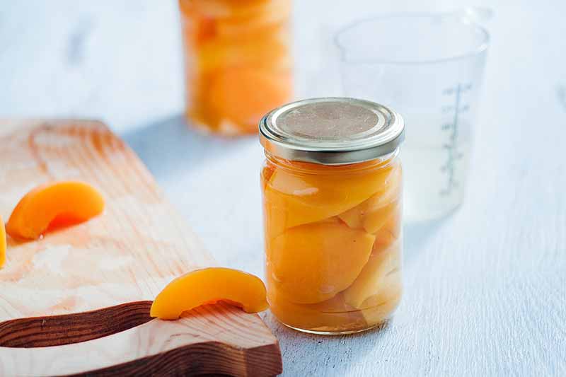 canned peaches on table
