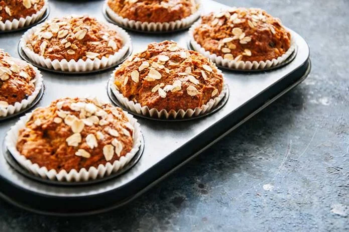 Carrot cake muffins with nuts raisins and oats