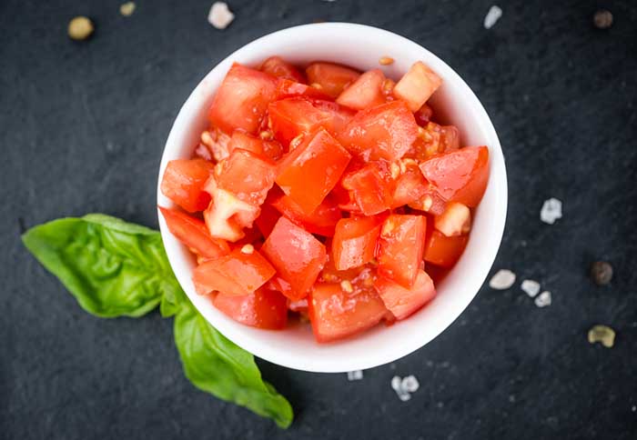 Diced Tomatoes in a Small White Bowl