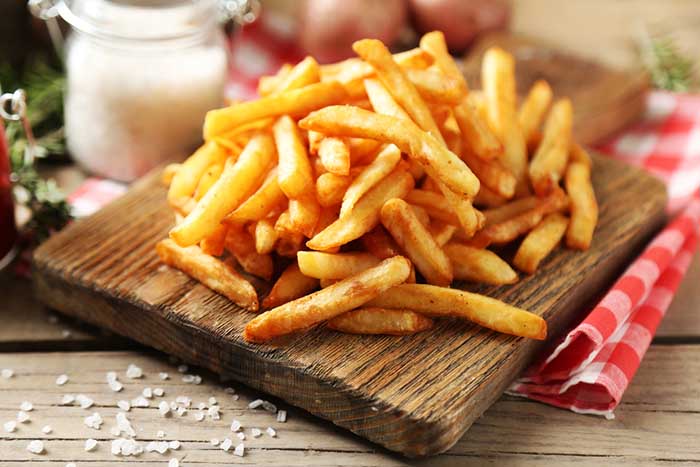 French Fries in a Wooden Chopping Board