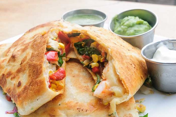 Grilled Shrimp Quesadilla with sour cream guacamole and salsa verde