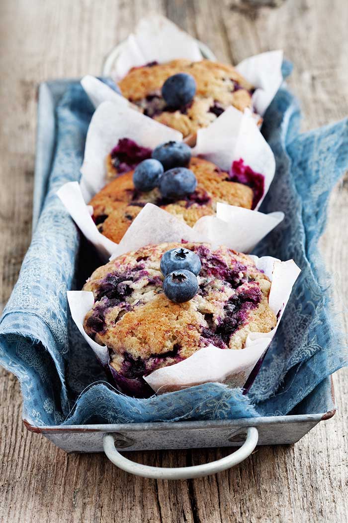 Homemade blueberry muffins in paper cupcake holder