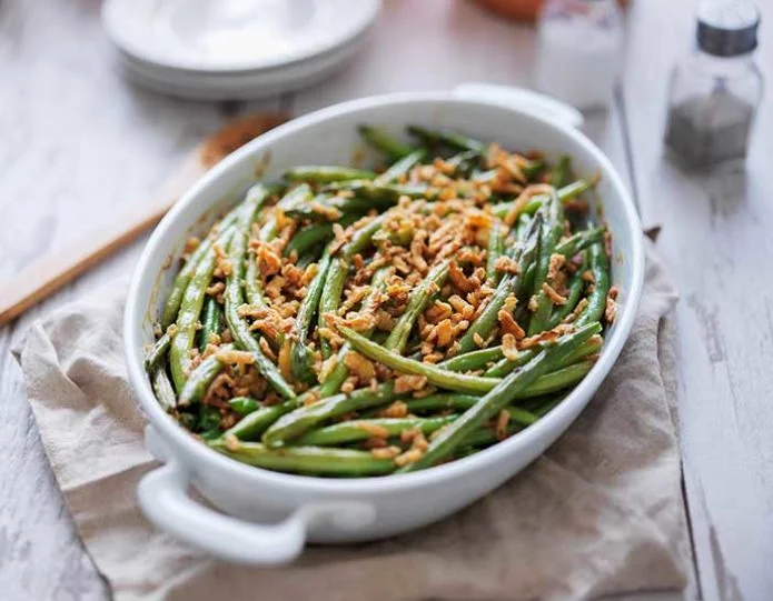 baked green bean casserole topped with french fried onions