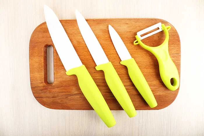 ceramic kitchen knives on cutting board