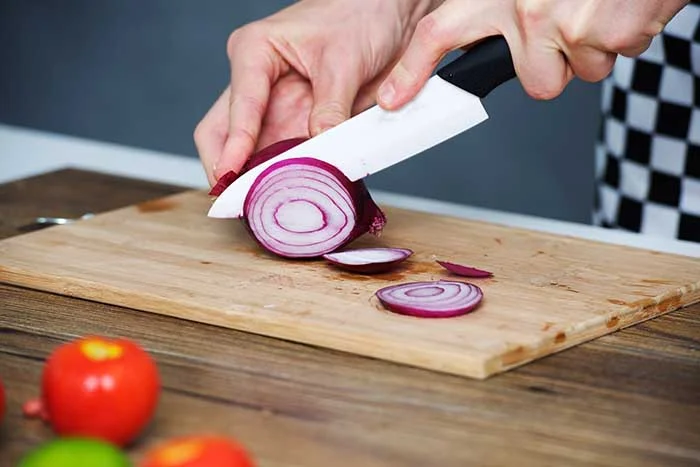 ceramic kitchen knives on cutting board