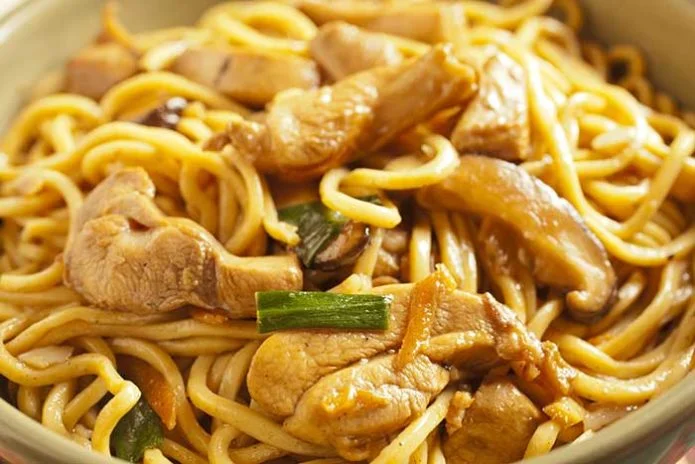 close-up of shredded chicken lo mein noodles