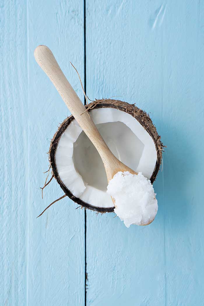 coconut oil on blue wooden table