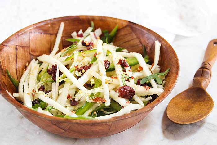 jicama salad in wooden salad bowl