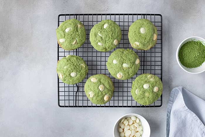 green tea matcha cookies with white chocolate chips on cooling rack