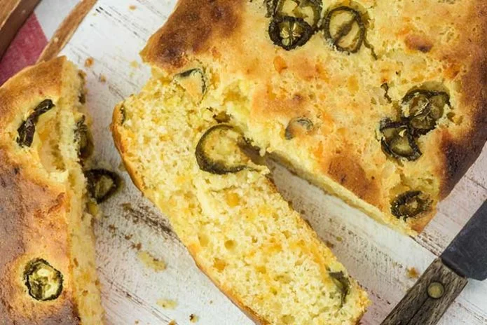 mexican cornbread with sliced jalapeno peppers and shredded cheese