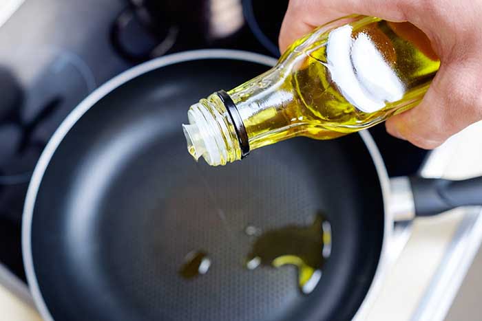 olive oil poured into hot pan