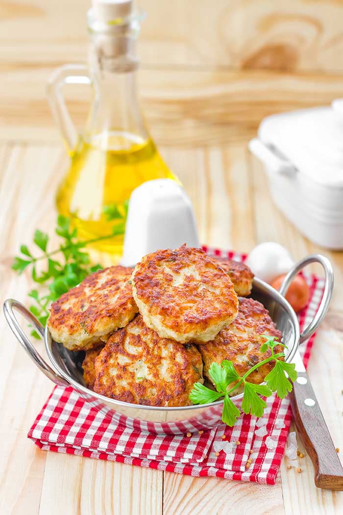 pan fried fish cutlets served in stainless serving dish