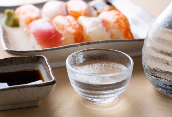 sake and sushi on the table