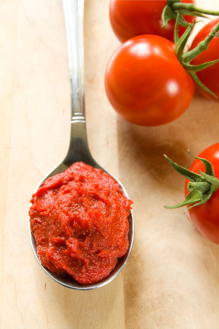 tomato paste spoon fresh ingredients