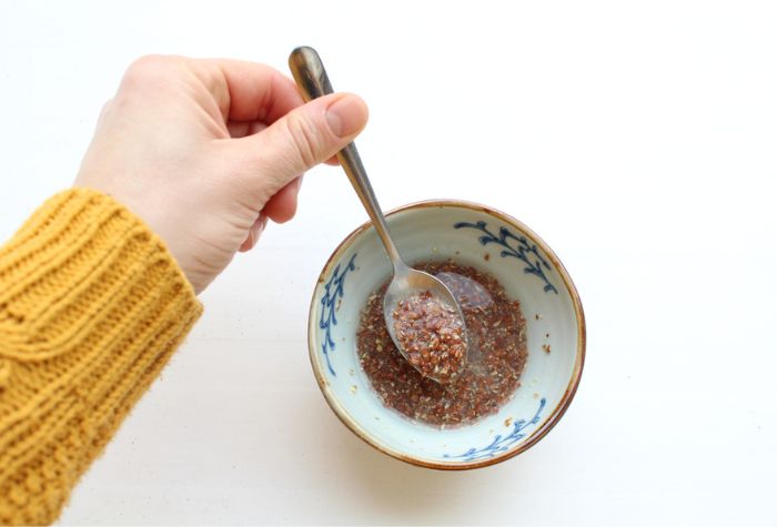 homemade flaxseed egg resting in bowl and kitchen dining spoon